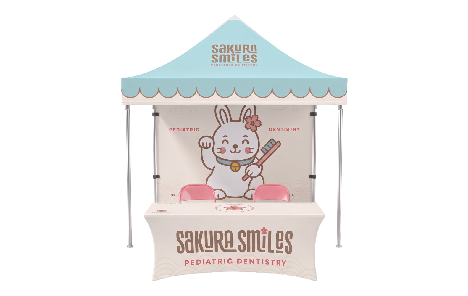 The Sakura Smiles event tent: scalloped teal canopy, lucky rabbit with a toothbrush on the back wall