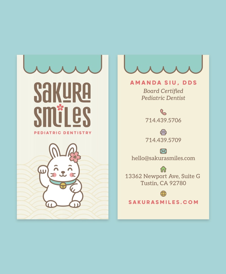 Business cards, front and back, under the scalloped awning